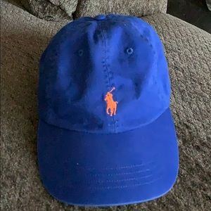 Unisex Dark Blue Polo Hat with orange emblem
